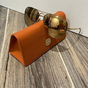 Ultra reflective gold Ray Ban aviator sunglasses with orange Tory Burch case